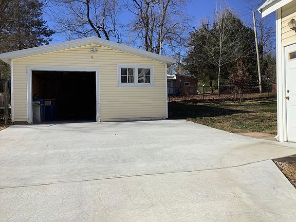 Garage with shop or storage room on the right