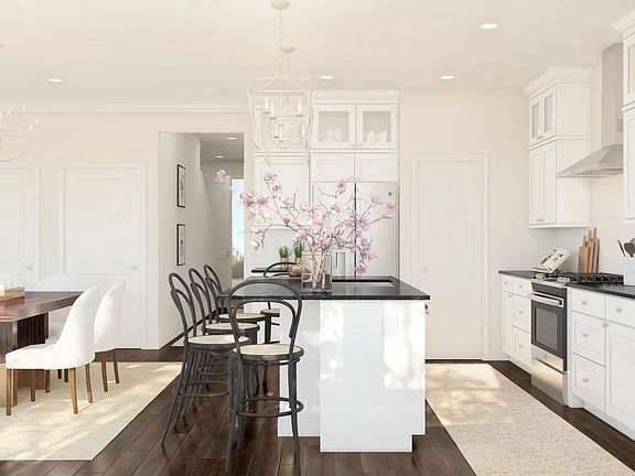 Kitchen with glass upper cabinets and pendant lighting