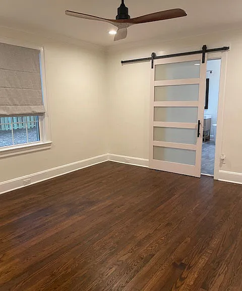 Master bedroom with barn door to master bath