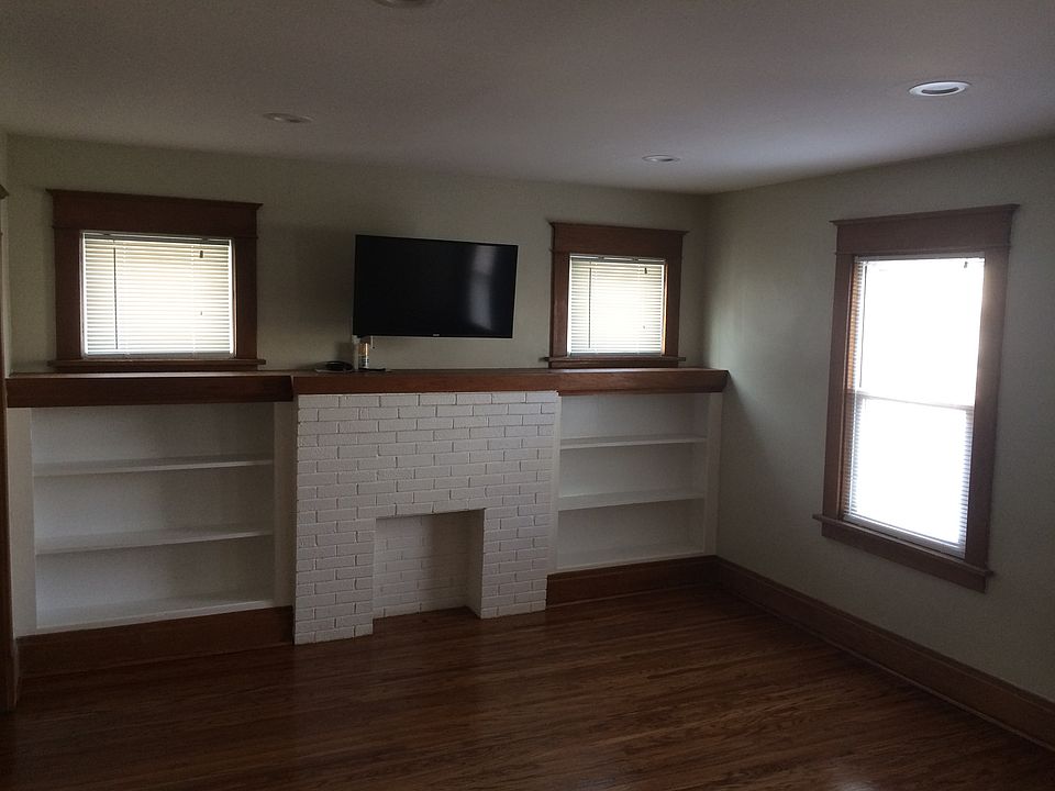 Living room with mantel and natural wood!