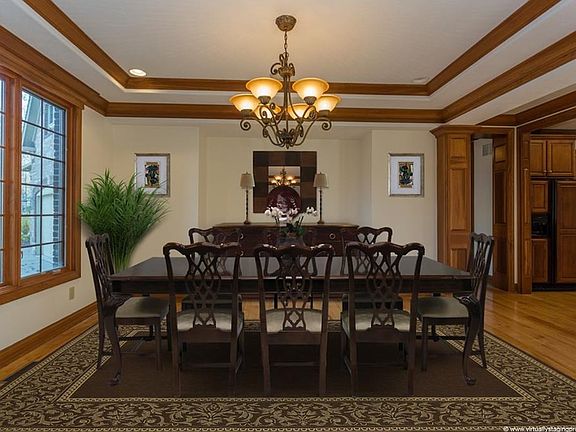 Fabulous formal dining room with custom tray ceiling and extensive trim work. This room has been virtually staged.