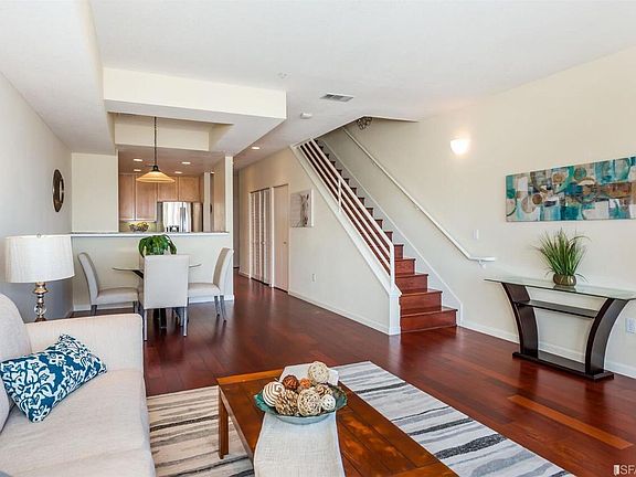 Townhouse-style condo with living, dining, kitchen and half bathroom on the first floor. Master suite and guest bedroom and bathroom on second floor. Brazilian cherry hardwood floor throughout.