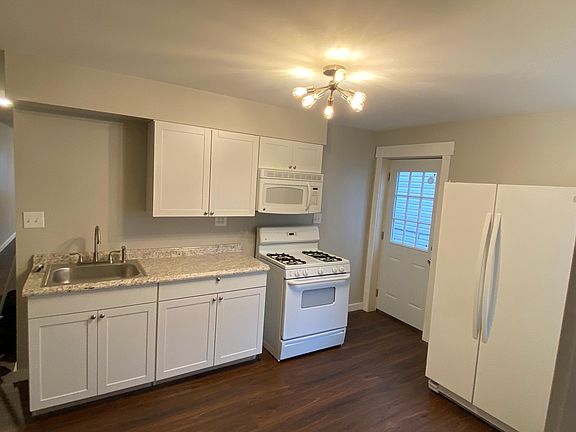 Kitchen with walkout to private fenced-in patio
