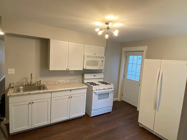 Kitchen with walkout to private fenced-in patio
