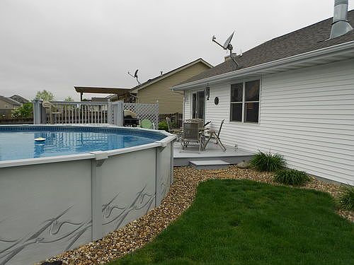Completely fenced backyard with 24' pool. Large decks w/ upper deck for pool.