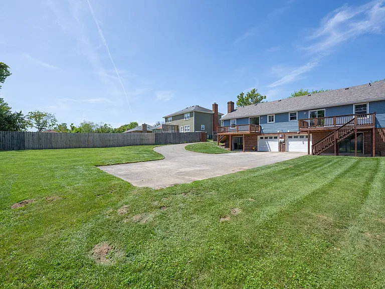 Large yard with plenty of parking, and single car garage