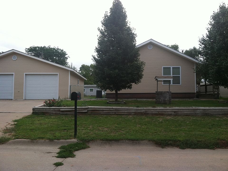 Front of house with 2 car