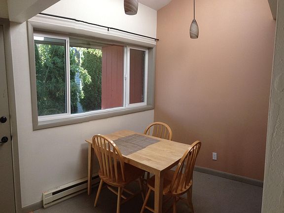 Dining area with vaulted ceiling and skylight