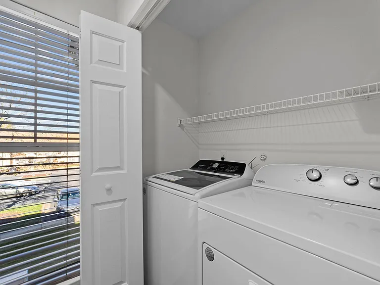 NEW washing machine and dryer off of the kitchen.
