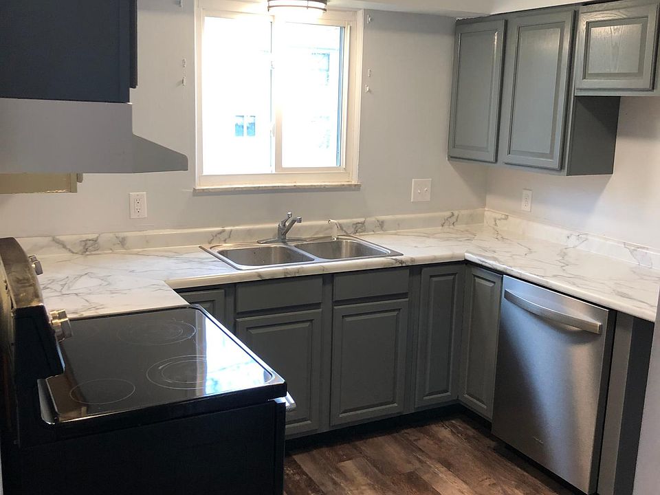 Dishwasher, range, and refrigerator included.