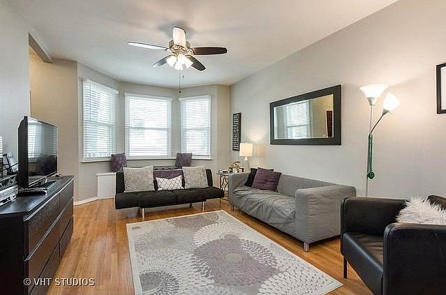 Spacious living area with hardwood floors