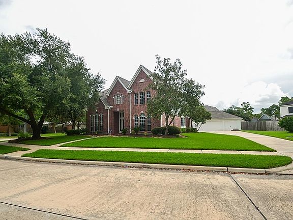 Over sized corner lot with three car garage and wide driveway