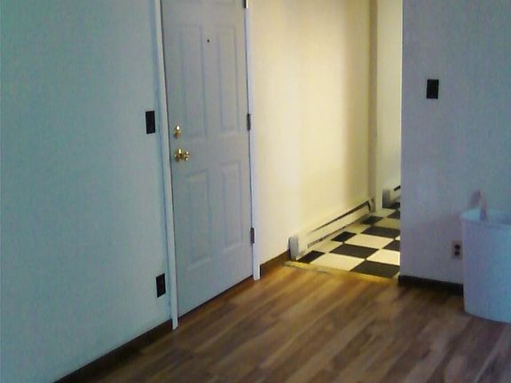 Looking toward kitchen and Apt. entry door, bath from Living Room