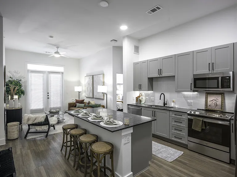 Upgrade your culinary space with stunning granite countertops and a spacious kitchen island, perfect for both style and functionality.