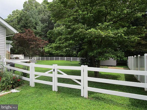 Gate to back yard with large shed.
