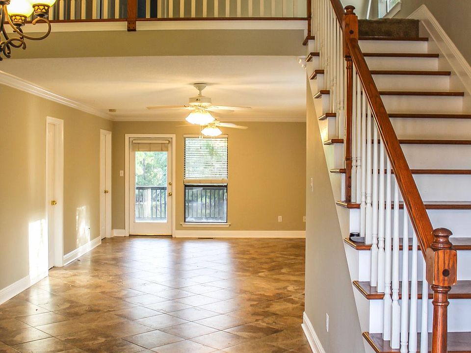 Open floor plan living area with master suite. Both feature views of Bayou Bonfouca and a private deck .