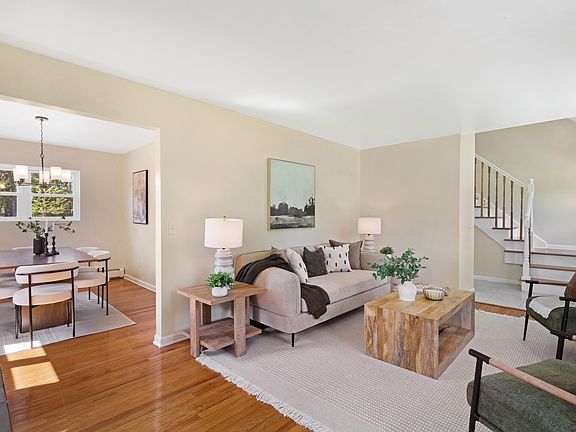 Living room open to dining room and entry