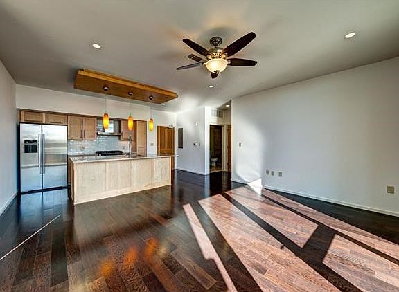 Beautiful wood flooring throughout entry, kitchen and living