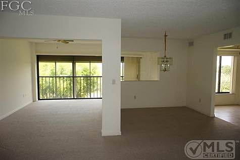Florida Room to left, Dining Room Center, Entryway to Kitchen.