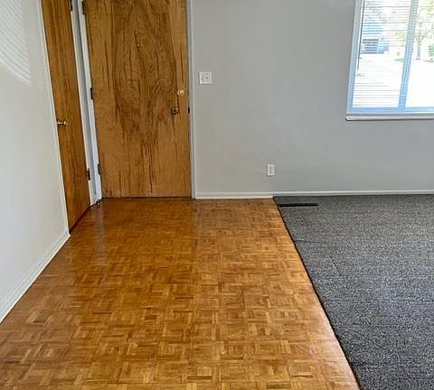 Parquet flooring as you enter living room