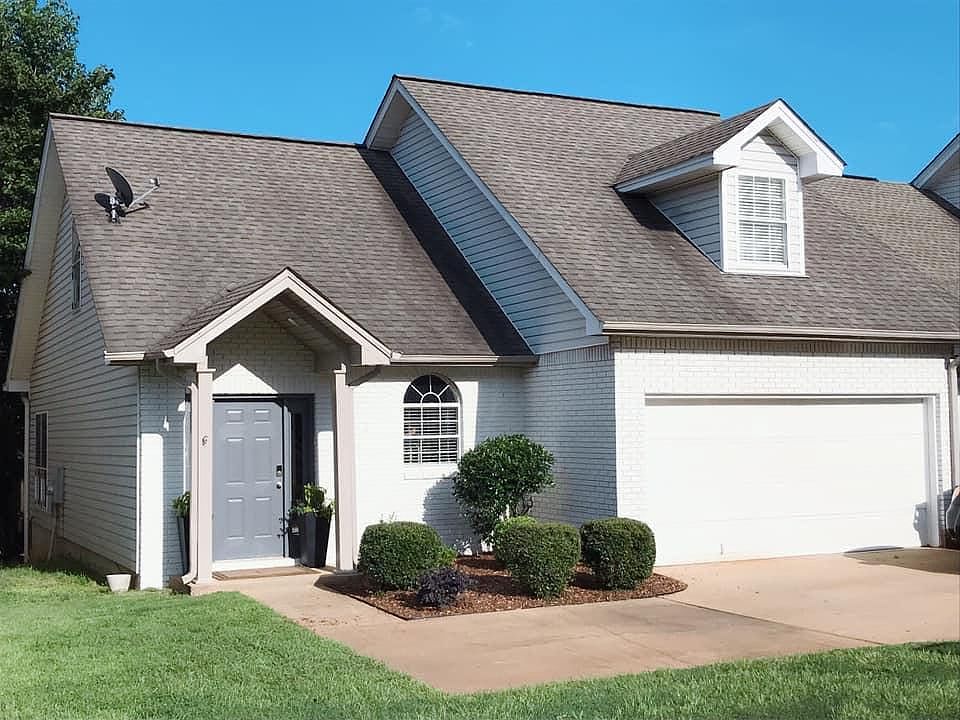 Exterior with new modern paint & landscaping. Enjoy using the garage & off-street parking.
