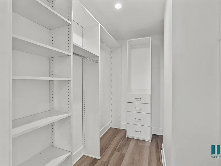 Walk-In Closet with Built-In Organizers and Shelving