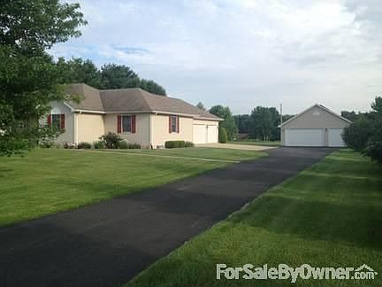Front
						:
						From the beginning of the driveway, lot extends beyond rear of the detached gar.