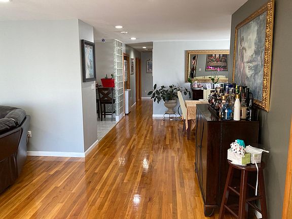 Living Room leading to Dining and Kitchen Area