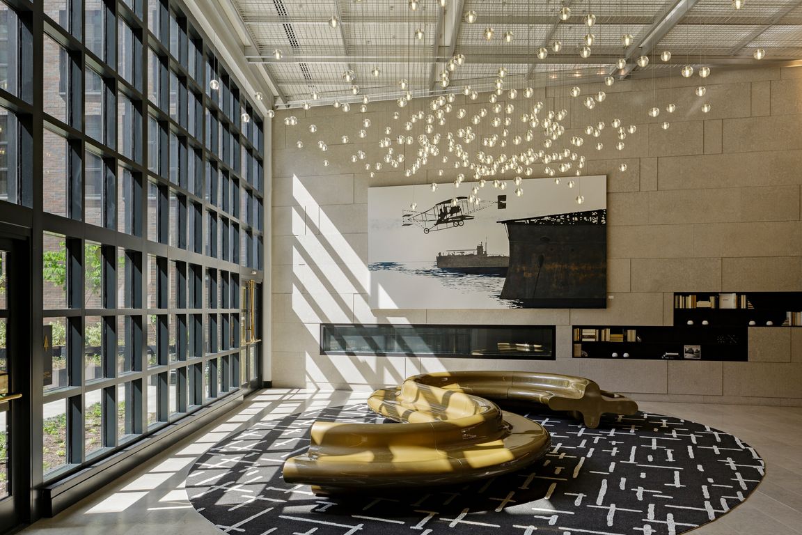 Well appointed resident clubroom with floor to ceiling windows