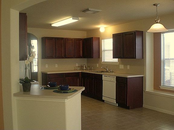 The breakfast bar separates the kitchen from the family room.