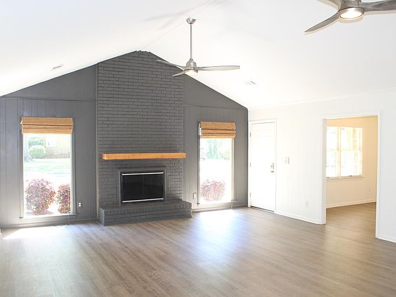 Spacious 26 x 18 living room with 11 _ ft. vaulted ceiling