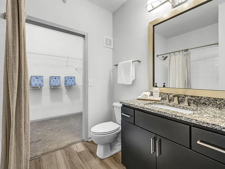Two Bedroom - Bathroom with framed mirror and rainfall shower head
