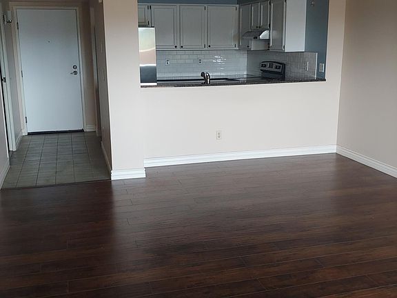 Spacious family/dining area with ceiling fan