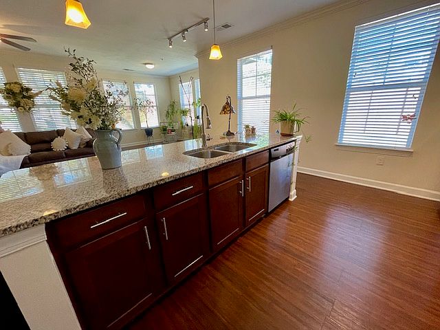 Bright spacious kitchen with large island and granite countertops.