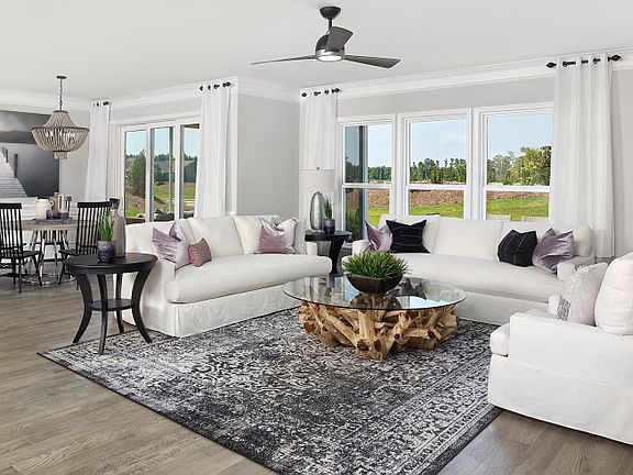 Gathering room with view of the backyard and optional fireplace. -Model Representation