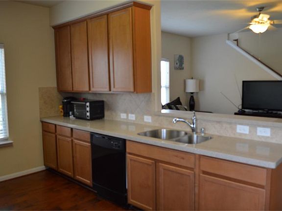 42" upgraded cabinets and solid surface counter tops. The sink is upgraded as well!