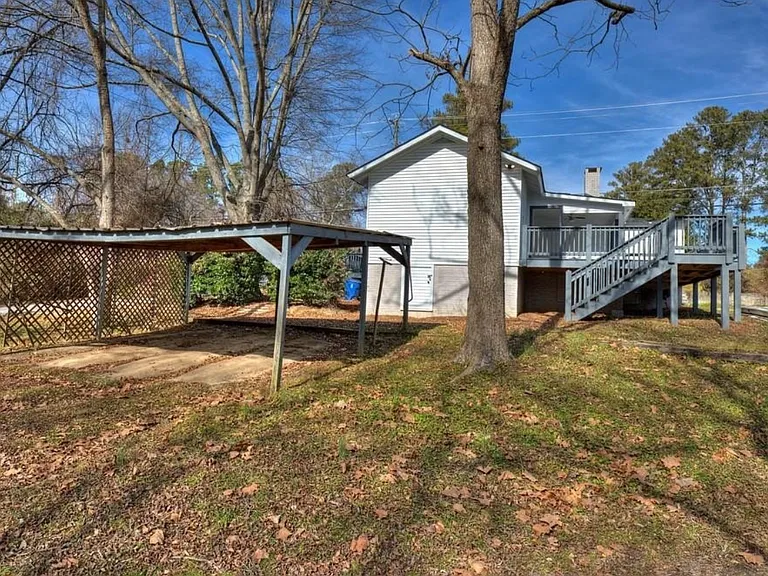 Carport and gravel driveway for plenty of parking