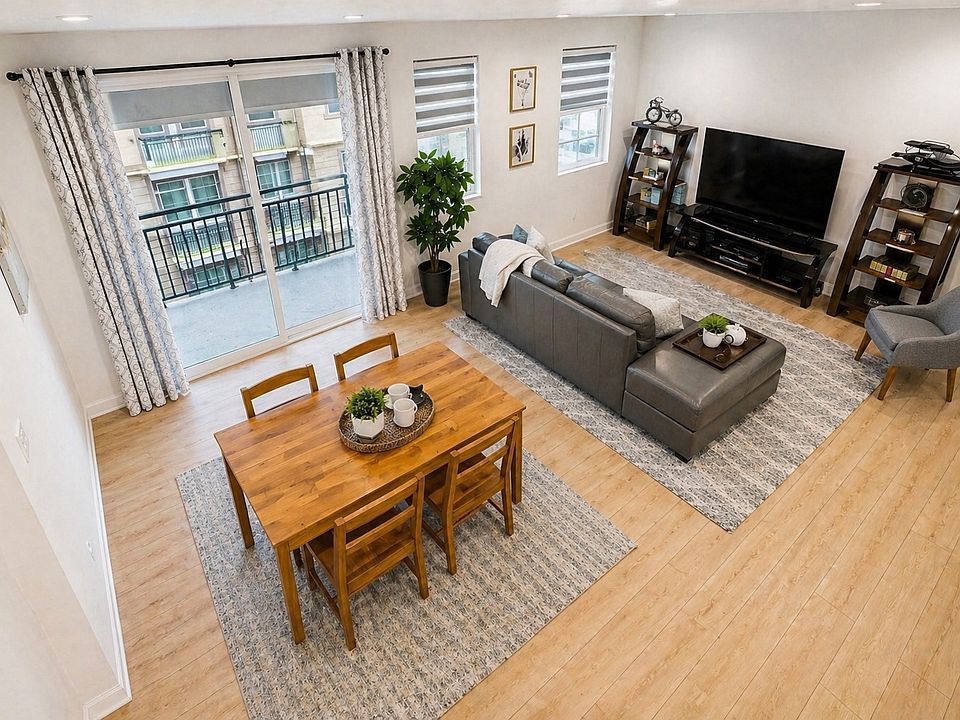 Dedicated dining space with modern furniture, perfectly situated between the kitchen and living room.