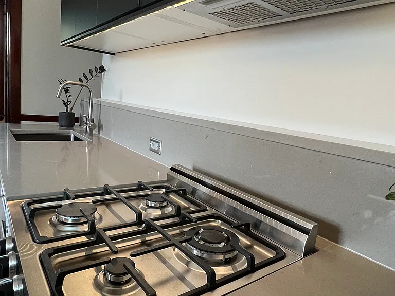 Stone Counters with Range Exhaust Hood - ducted to exterior.
