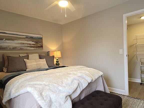 Spacious master bedroom with walk-in closet and private en suite bathroom.