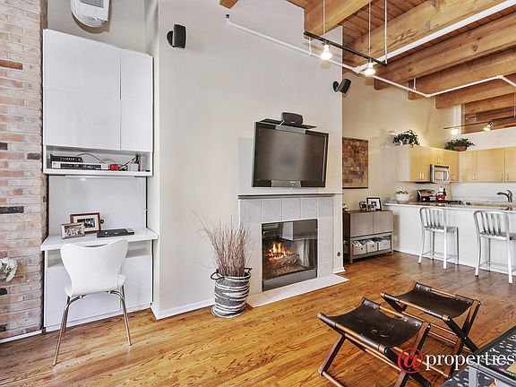 Living Room with Built In Office & Gas Fireplace