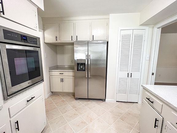 freshly updated kitchen with a big pantry, brand new side by side fridge/freezer, oven, dishwasher, and sink. Tons of storage throughout and great open flow to the dining/ living areas.