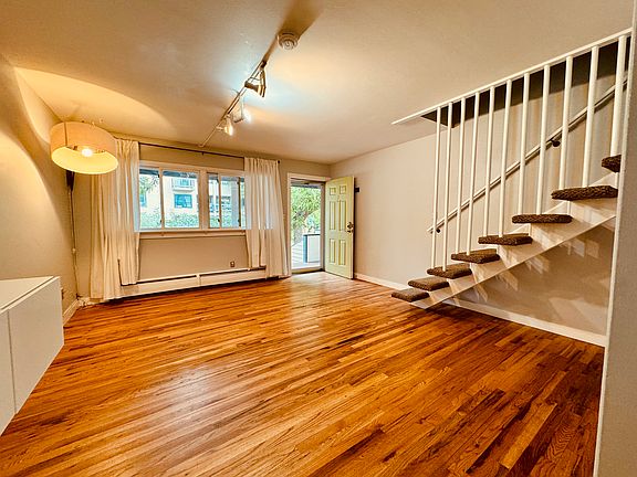 Living space when you first walk in, built in cabinets perfect for storage, hardwood flooring