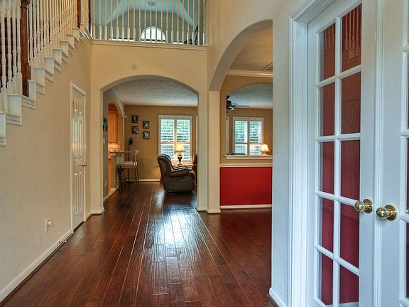 Gorgeous hardwood floors throughout the main living areas, arched entrances and high volume ceiling.