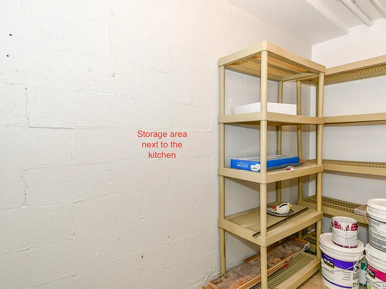 Indoor, private storage room, accessible from kitchen