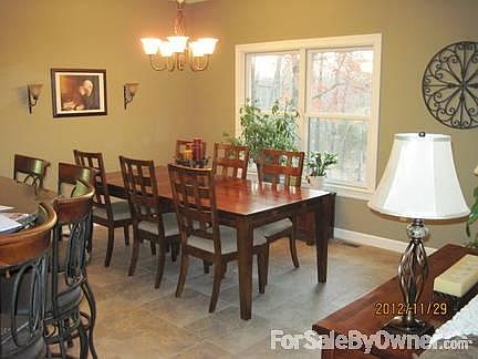 Dining area
						:
						20x20 porcelain tile floors. Great view of the wooded back yard.