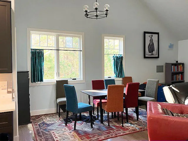 Open space includes dedicated dining room area with seating for 6