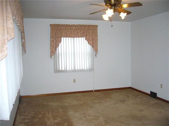 Large living room with two large windows, and lots of natural sunlight!