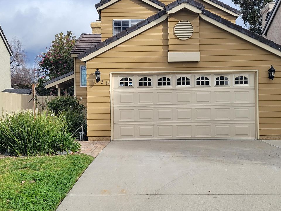 Street view, with 2 car garage and automatic roll-up garage door