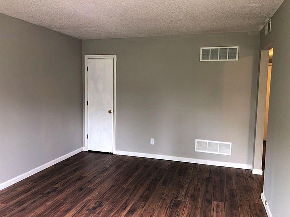 main living room with closet, new laminate floors throughout